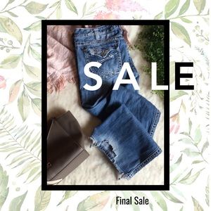 Distressed silver jeans